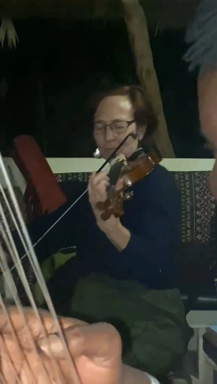 Mafu Conteh with student playing violin