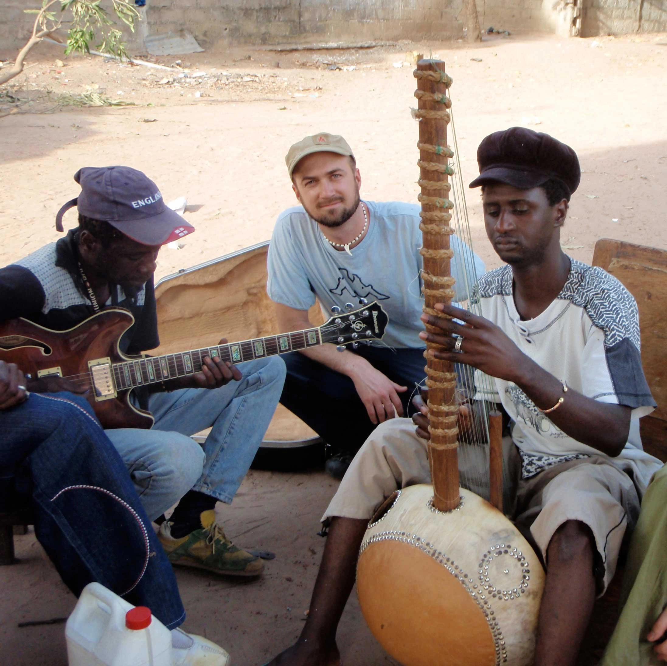 Steve Pile standing with Jali Bakary Konteh